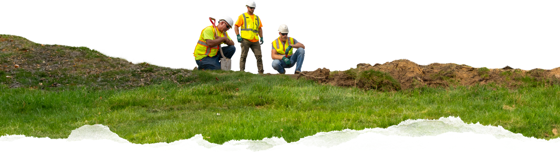 AUS workers standing on a grassy hill