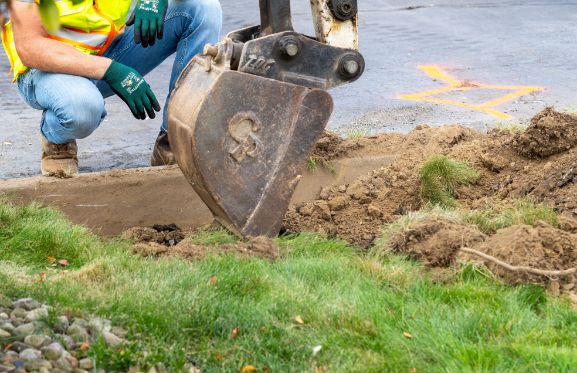 Excavator digging in the ground